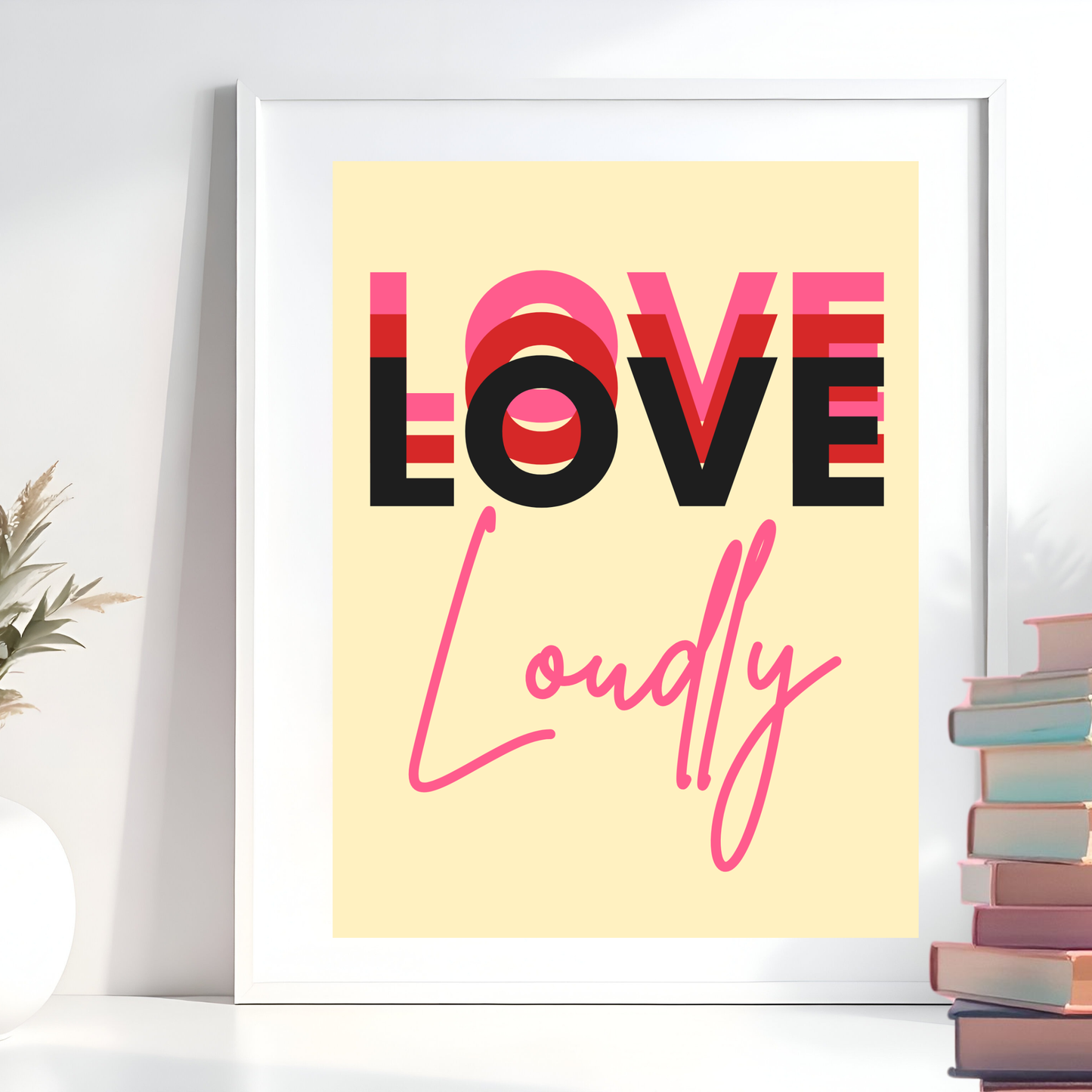 Framed poster with 'LOVE LOUDLY' text on a yellow background